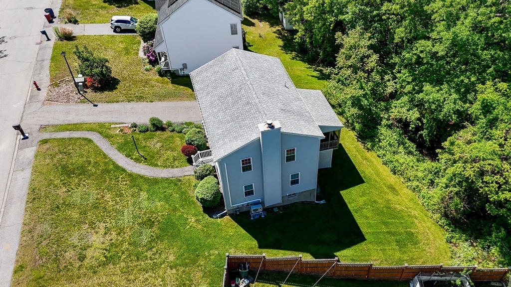 218 Acropolis Road Lowell, MA 01854 - Photo 36 of 39 an aerial view of residential house with outdoor space and trees all around