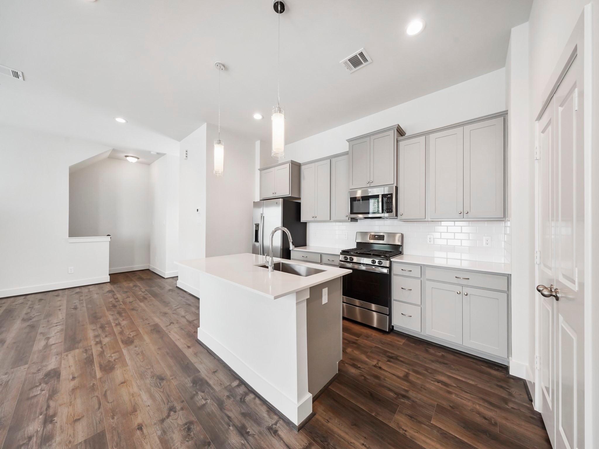 2007 Bauer Drive, Unit A Houston, TX 77080 - Photo 15 of 35 a kitchen with kitchen island a sink stainless steel appliances and cabinets