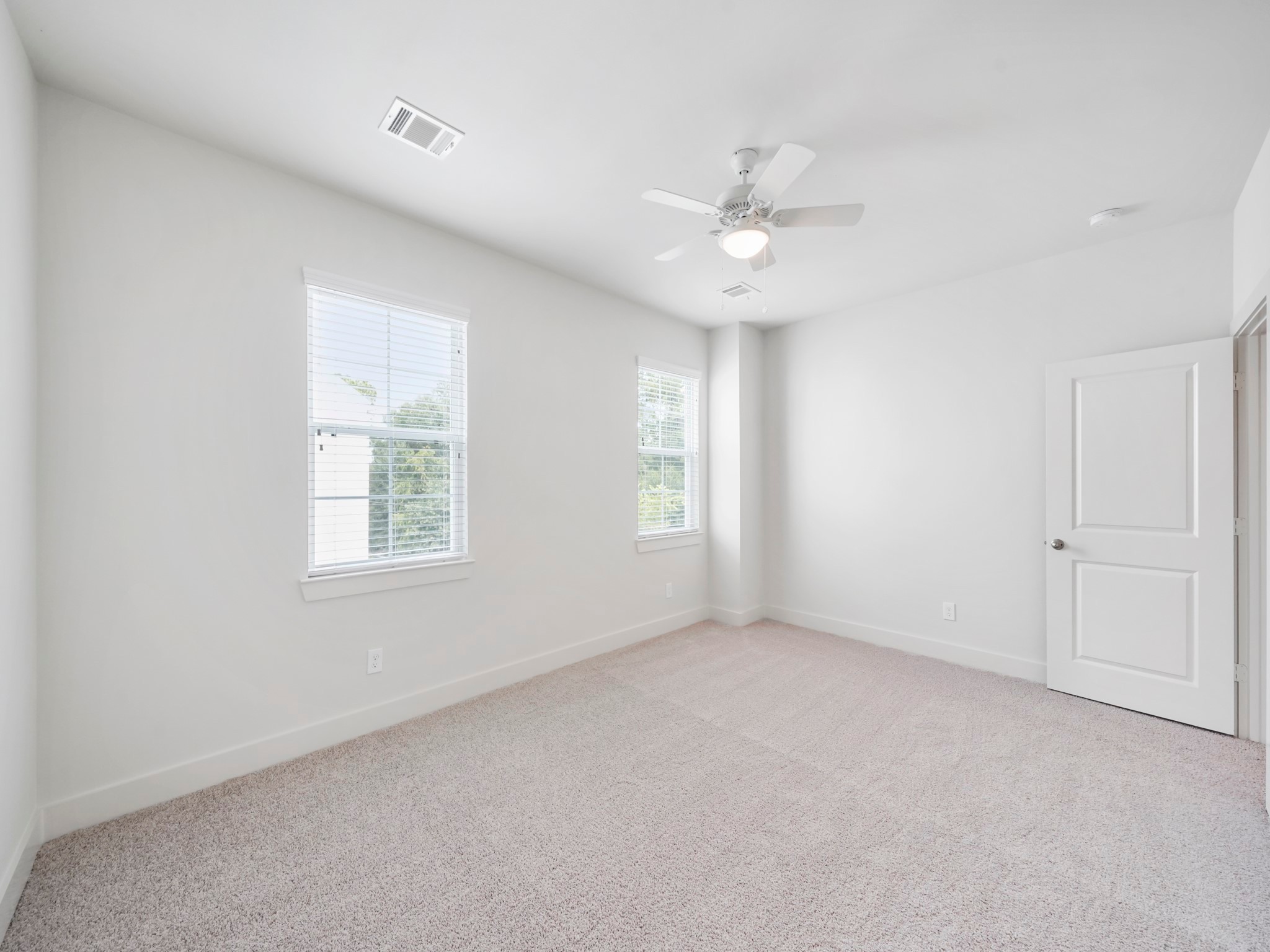 2007 Bauer Drive, Unit A Houston, TX 77080 - Photo 20 of 35 an empty room with a window and a fan