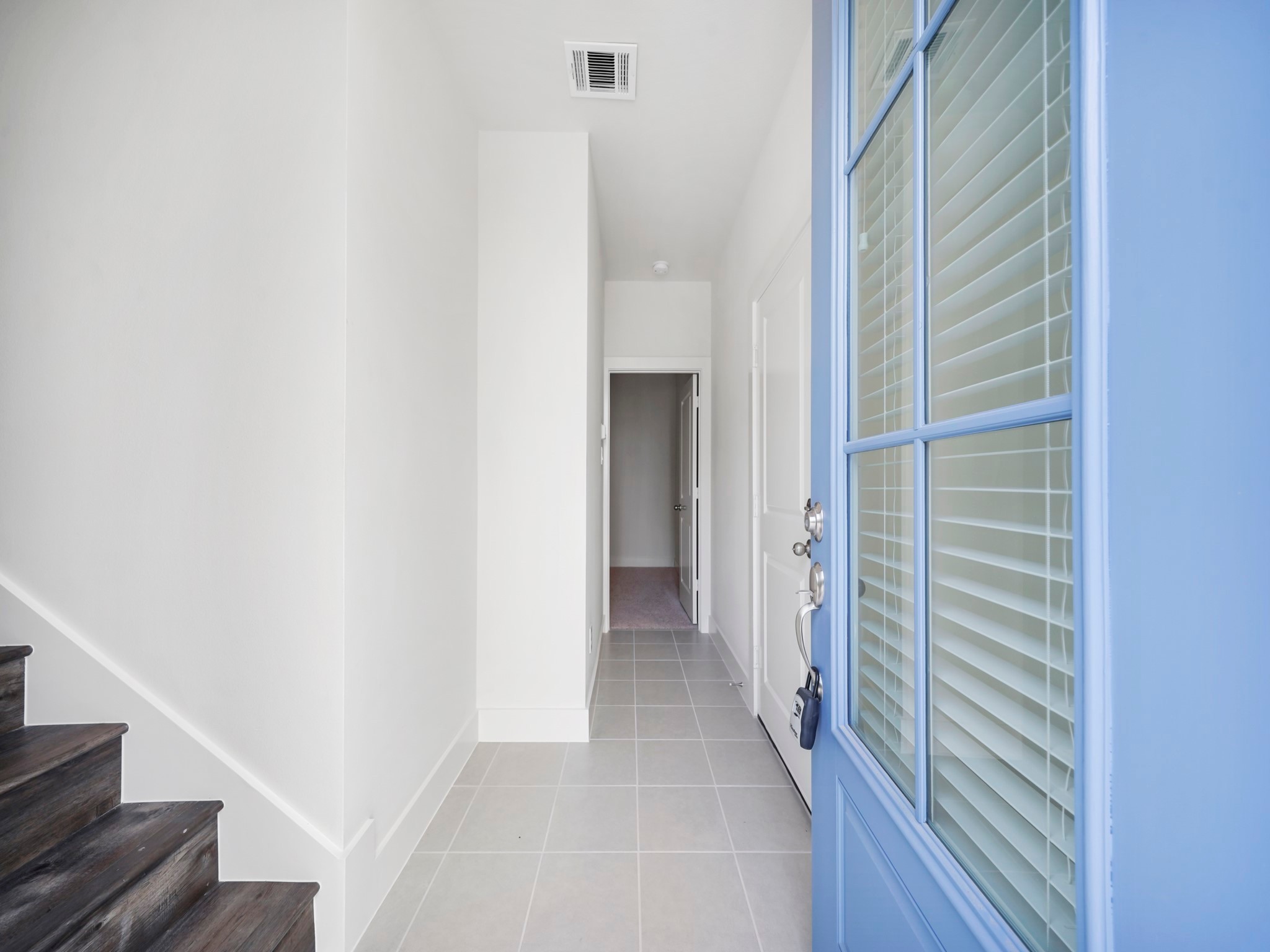 2007 Bauer Drive, Unit A Houston, TX 77080 - Photo 4 of 35 a view of a hallway with wooden floor and entryway