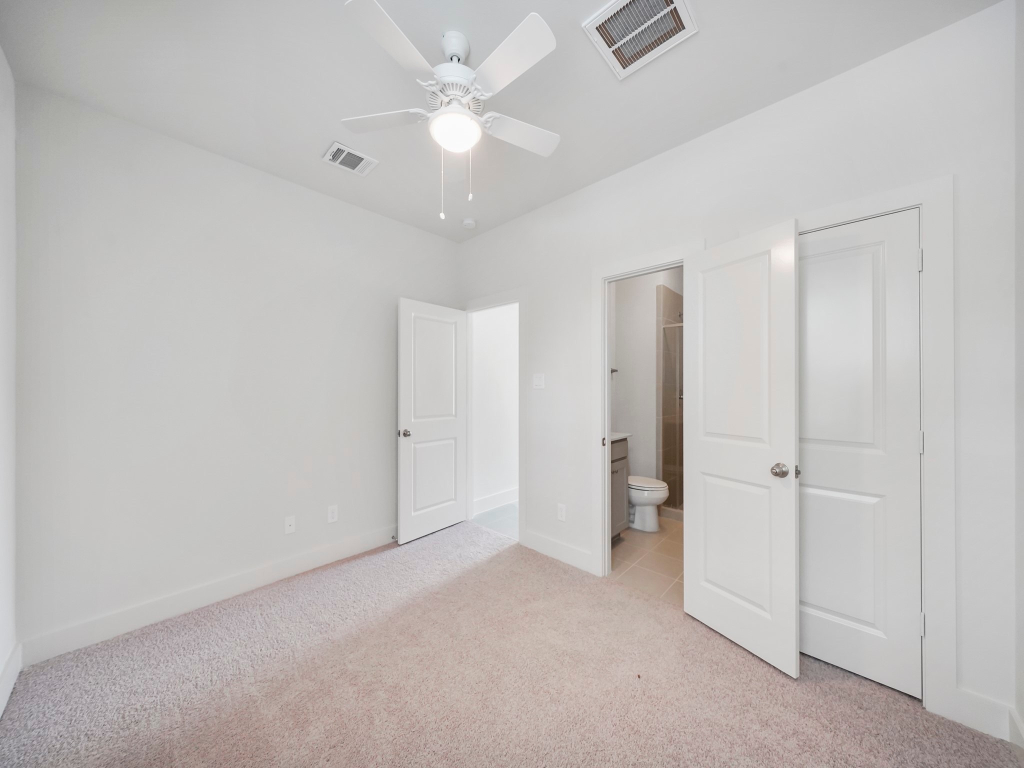 2007 Bauer Drive, Unit A Houston, TX 77080 - Photo 7 of 35 an empty room with a ceiling fan and closet area