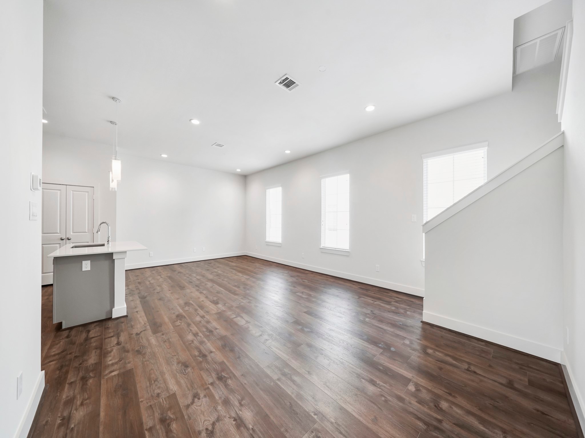 2007 Bauer Drive, Unit A Houston, TX 77080 - Photo 9 of 35 a view of an empty room with a kitchen and a window