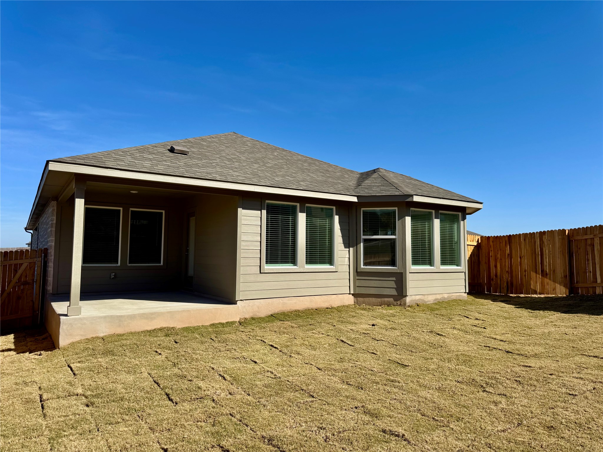 801 Sue Peaks Loop Dripping Springs, TX 78620 - Photo 5 of 18 a front view of a house with a yard