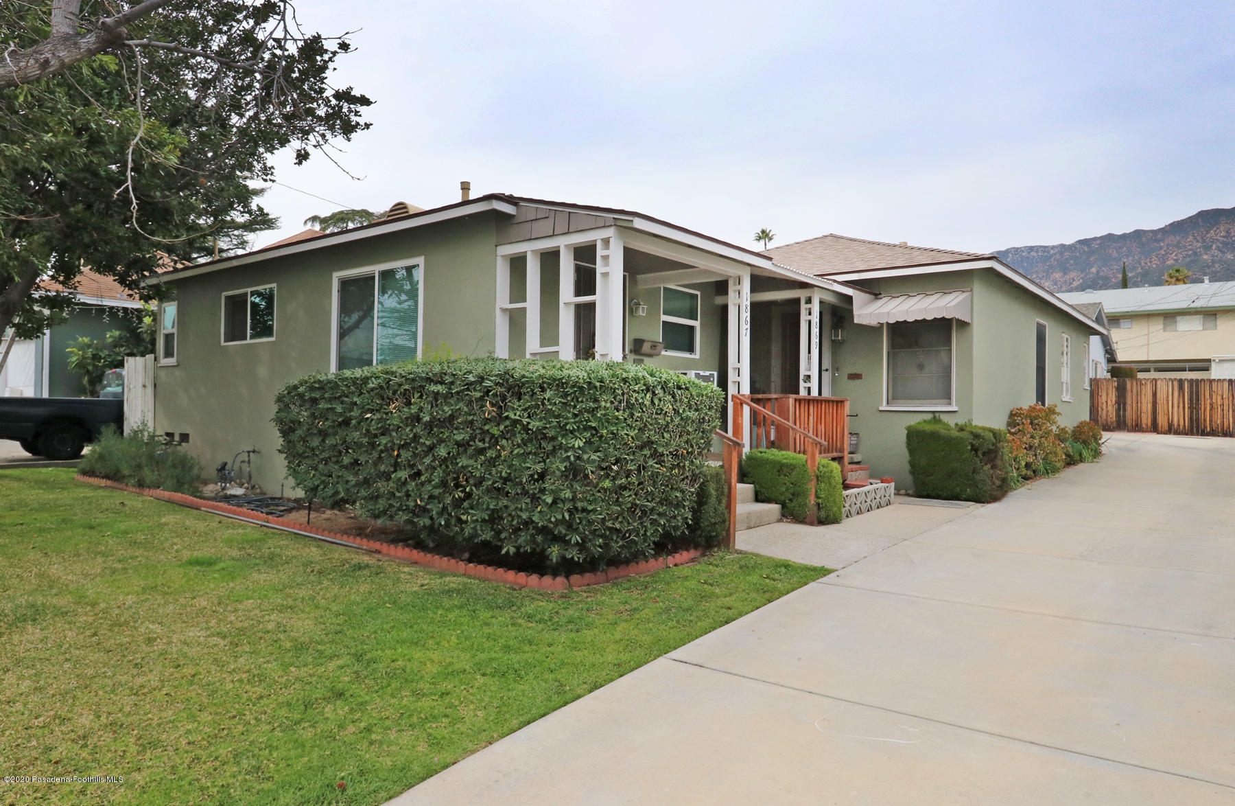 1867 Layton Street Pasadena, CA 91104 - Photo 1 of 22 a front view of a house with a garden