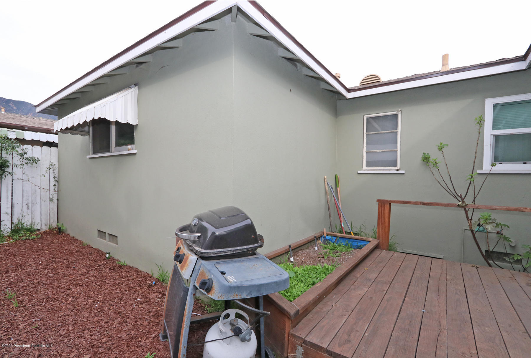 1867 Layton Street Pasadena, CA 91104 - Photo 13 of 22 a balcony with wooden floor table and chairs