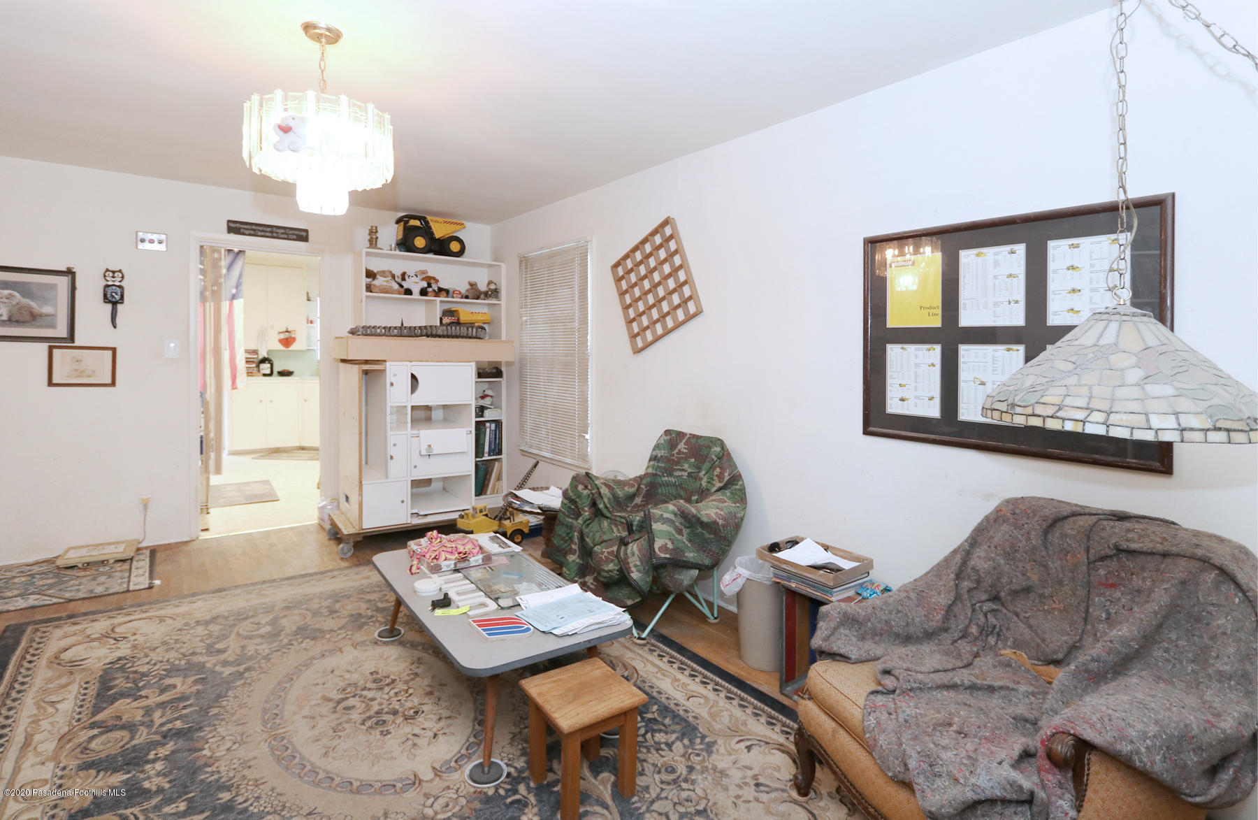 1867 Layton Street Pasadena, CA 91104 - Photo 17 of 22 a living room with furniture and a chandelier
