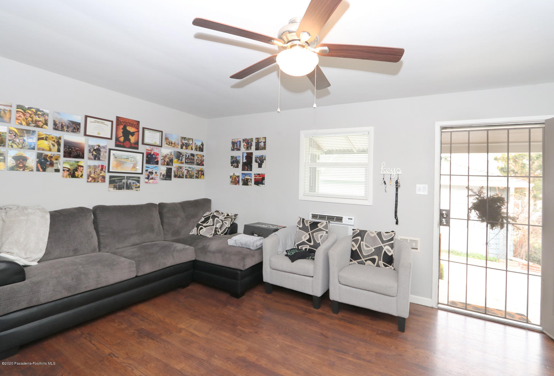 1867 Layton Street Pasadena, CA 91104 - Photo 5 of 22 a living room with furniture and a large window with wooden floor