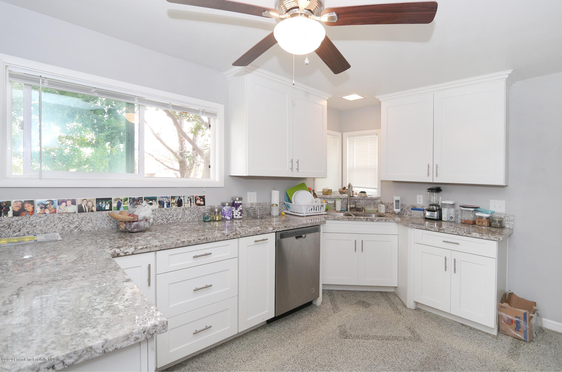 1867 Layton Street Pasadena, CA 91104 - Photo 7 of 22 a kitchen with granite countertop a sink cabinets window and stainless steel appliances