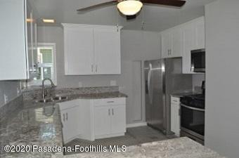 1867 Layton Street Pasadena, CA 91104 - Photo 8 of 22 a kitchen with a sink stainless steel appliances and cabinets