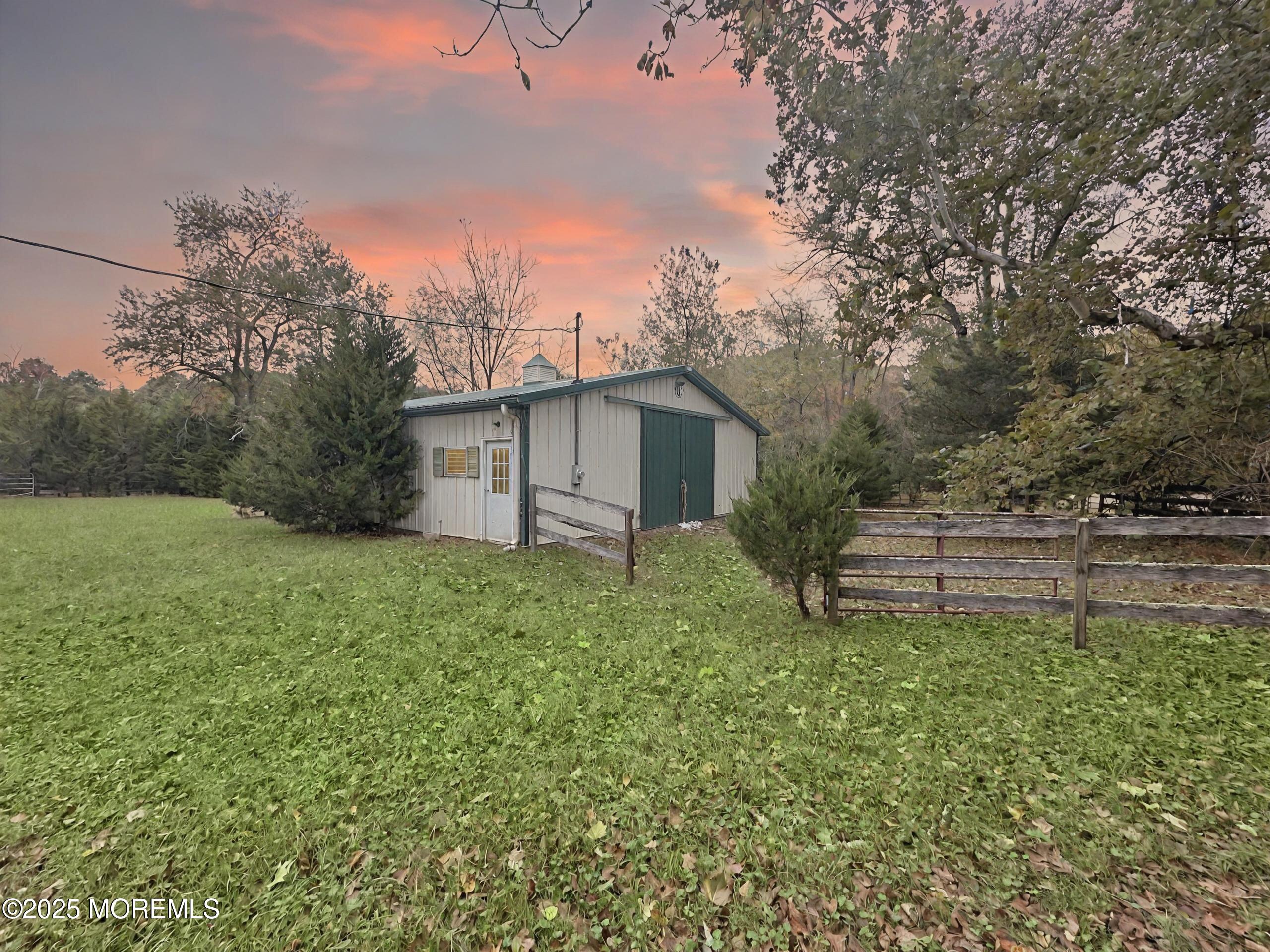 3 West Caines Drive Cream Ridge, NJ 08514 - Photo 20 of 22 a white house that has a tree in front of it