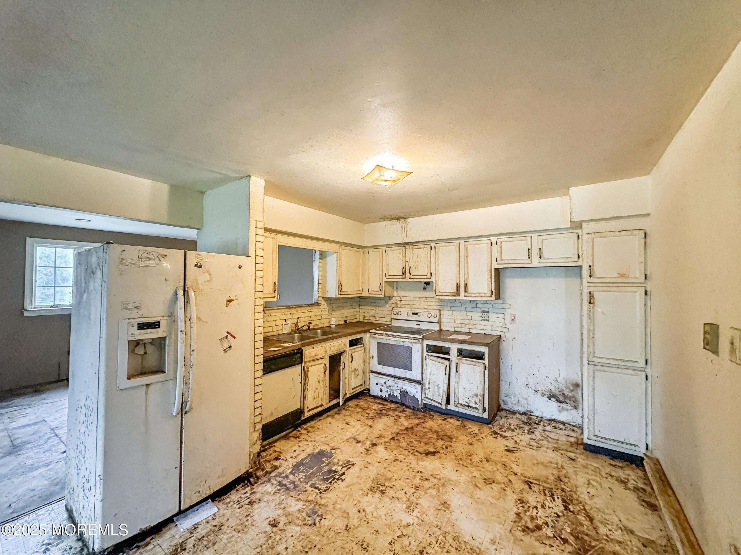3 West Caines Drive Cream Ridge, NJ 08514 - Photo 6 of 22 a kitchen with cabinets and stainless steel appliances