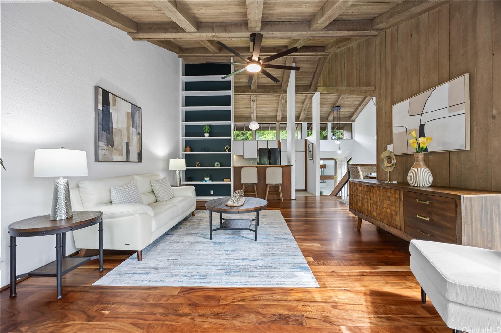 45-995 Wailele Road, Unit 35 Kaneohe, HI 96744 - Photo 9 of 25 Vaulted ceilings and koa floors adorn your living room which flows to your covered lanais