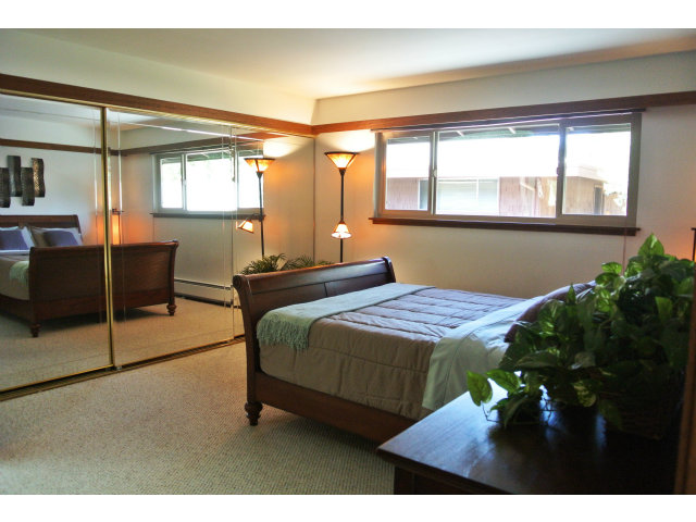 500 West Middlefield Road, Unit 154 Mountain View, CA 94043 - Photo 7 of 16 a bedroom with a bed mirror and window