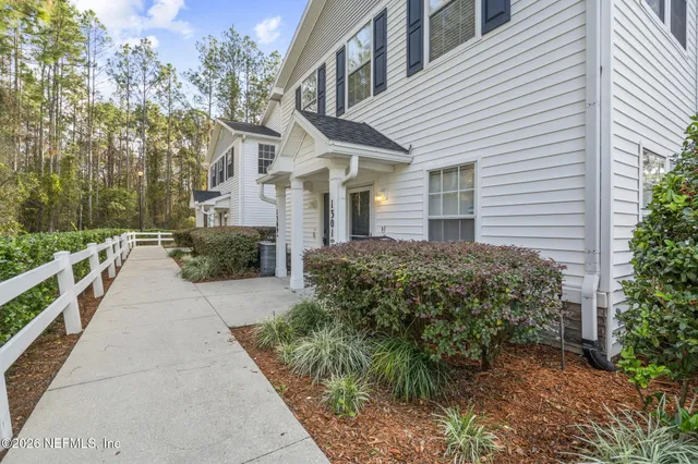 a view of a pathway with house on both side