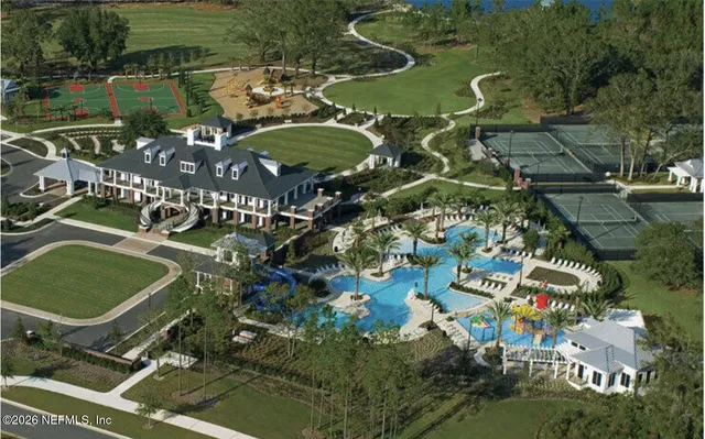 an aerial view of a houses with outdoor space