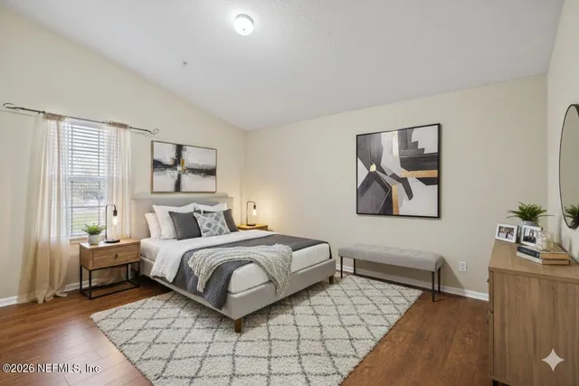 a bedroom with a bed and a couch