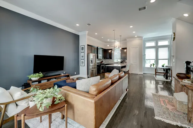 a living room with fireplace furniture and a flat screen tv