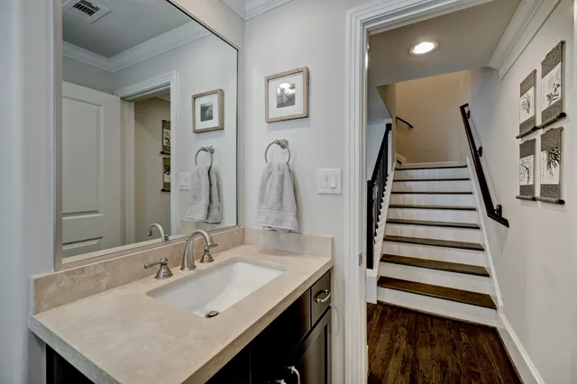 a bathroom with a sink and mirror