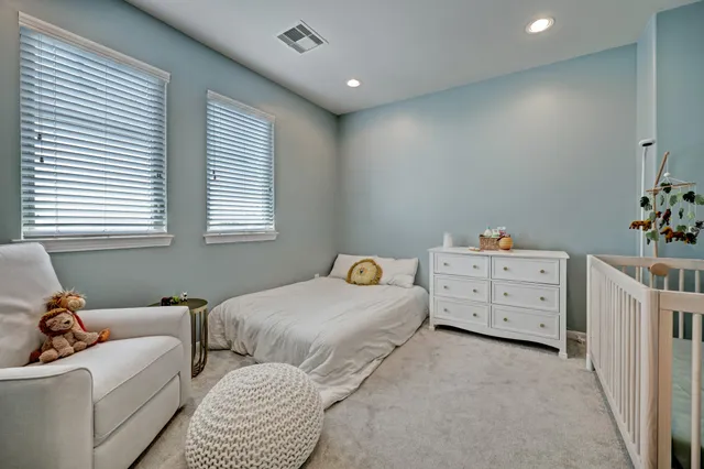 a bedroom with furniture and window