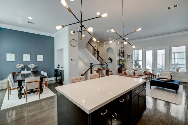 a large kitchen with a table and chairs