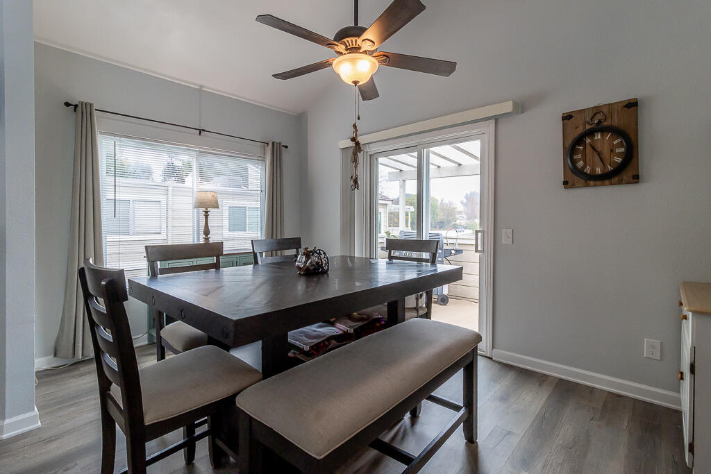 31355 The Old Road, Unit E Castaic, CA 91384 - Photo 11 of 38 a view of a dining room with furniture window and wooden floor