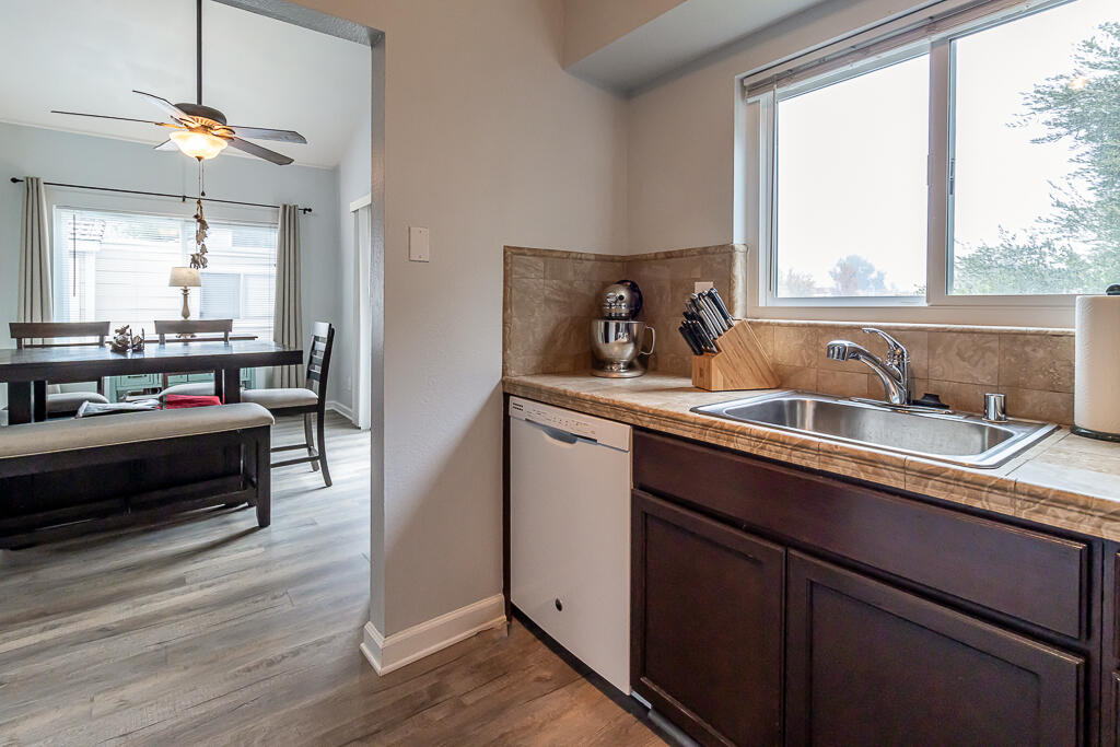 31355 The Old Road, Unit E Castaic, CA 91384 - Photo 15 of 38 a kitchen with a sink and wooden floor