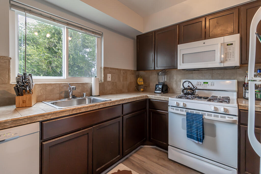 31355 The Old Road, Unit E Castaic, CA 91384 - Photo 16 of 38 a kitchen with a sink stove and microwave