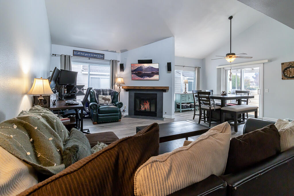 31355 The Old Road, Unit E Castaic, CA 91384 - Photo 17 of 38 a living room with furniture fireplace and kitchen view