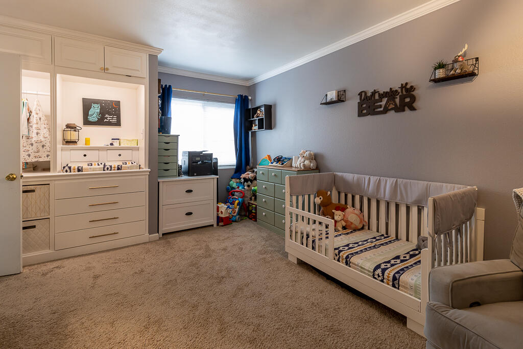 31355 The Old Road, Unit E Castaic, CA 91384 - Photo 18 of 38 a bedroom with furniture and window