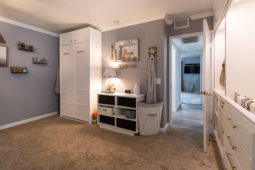 31355 The Old Road, Unit E Castaic, CA 91384 - Photo 20 of 38 a view of room with cabinet and windows