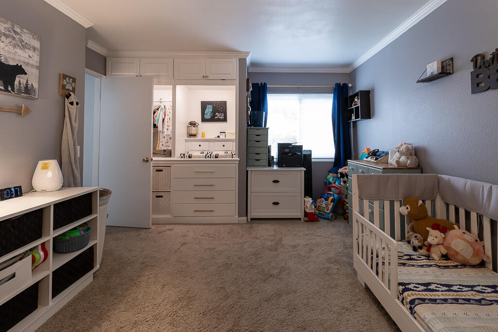 31355 The Old Road, Unit E Castaic, CA 91384 - Photo 21 of 38 a bedroom with furniture and a window