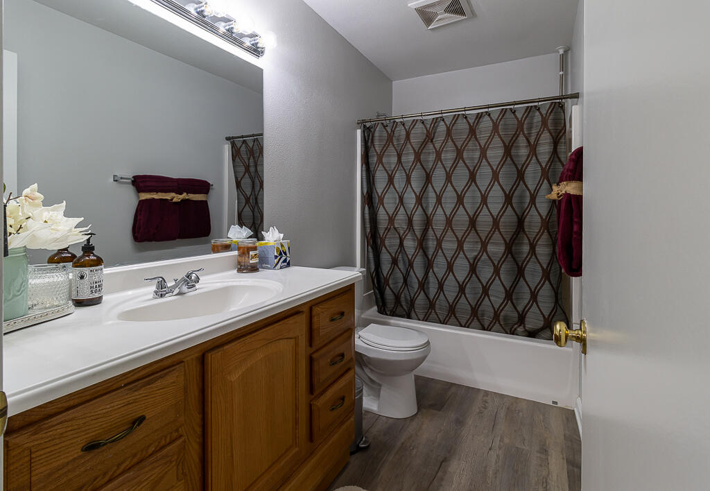 31355 The Old Road, Unit E Castaic, CA 91384 - Photo 22 of 38 a bathroom with a sink and a mirror