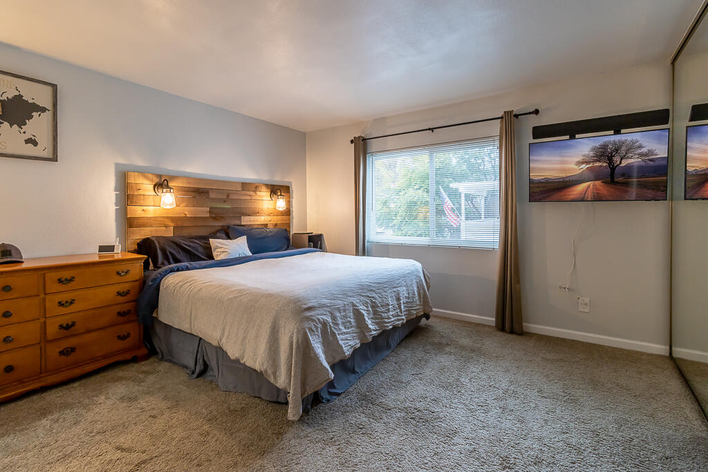 31355 The Old Road, Unit E Castaic, CA 91384 - Photo 24 of 38 a bed sitting in a bedroom next to a window