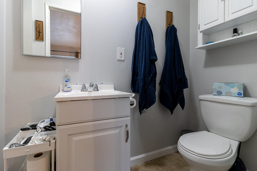 31355 The Old Road, Unit E Castaic, CA 91384 - Photo 27 of 38 a bathroom with a sink and a toilet
