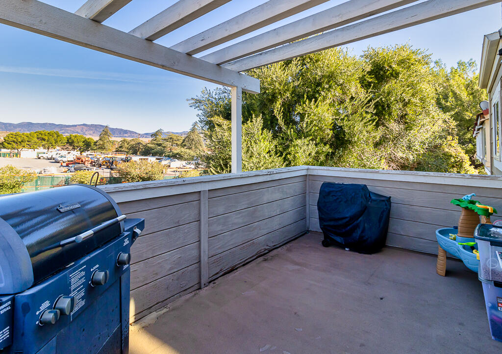 31355 The Old Road, Unit E Castaic, CA 91384 - Photo 29 of 38 a sitting area with wooden floor and fence