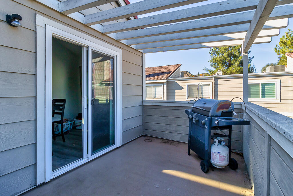 31355 The Old Road, Unit E Castaic, CA 91384 - Photo 30 of 38 a view of a porch with chairs and a gate