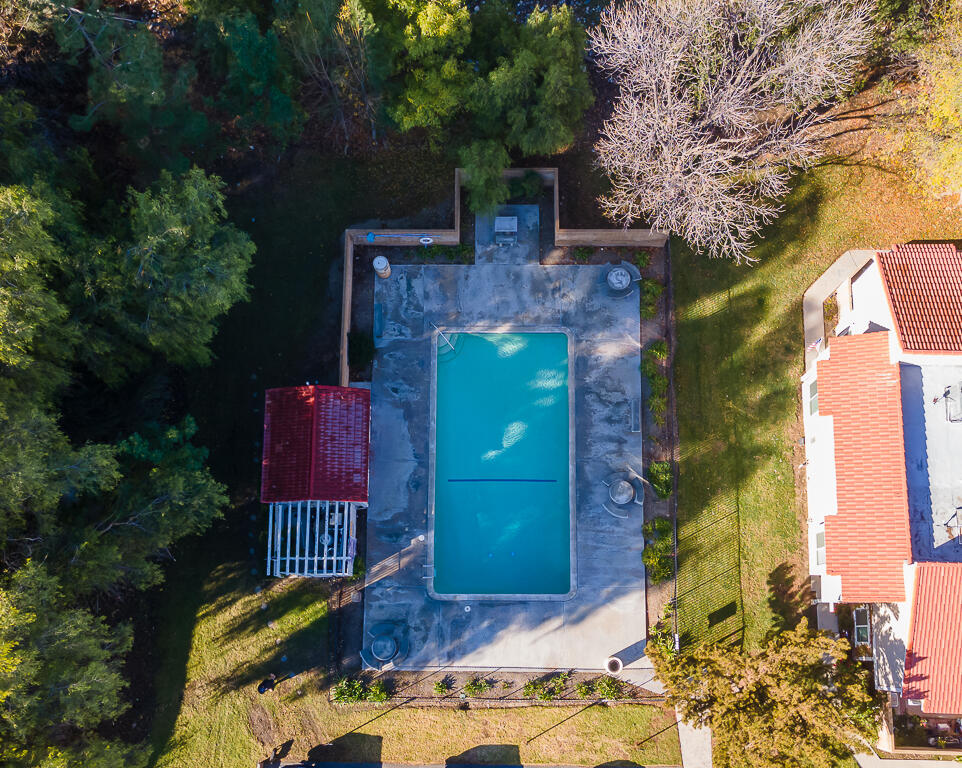 31355 The Old Road, Unit E Castaic, CA 91384 - Photo 3 of 38 a view of a house with a large tree and a yard