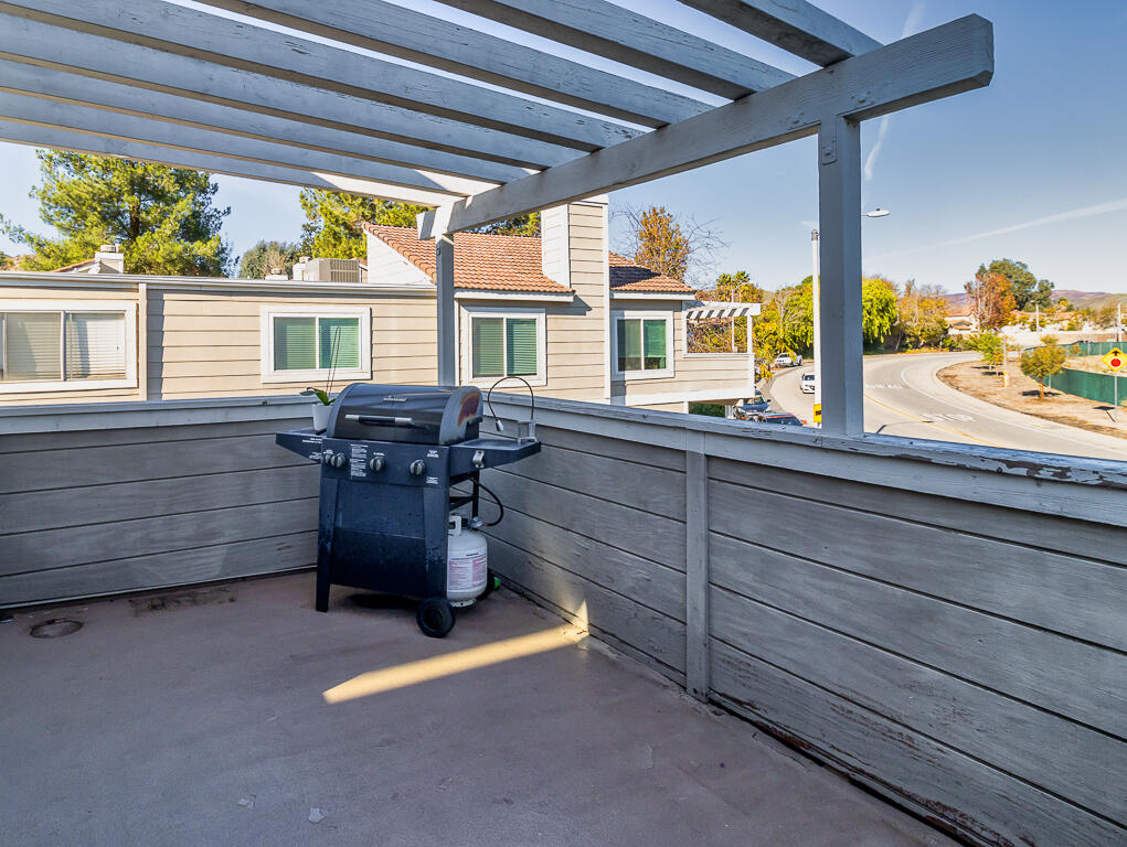 31355 The Old Road, Unit E Castaic, CA 91384 - Photo 31 of 38 a room with wooden floor and furniture