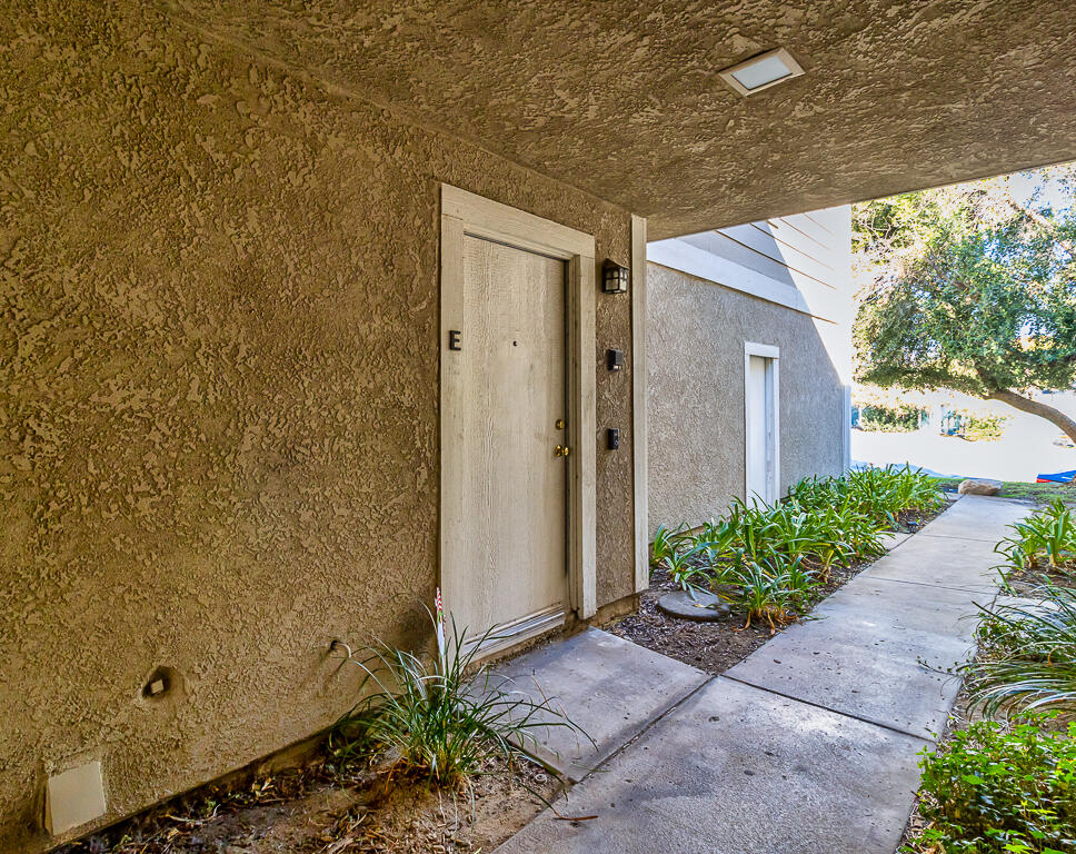 31355 The Old Road, Unit E Castaic, CA 91384 - Photo 32 of 38 a front view of a house with a yard