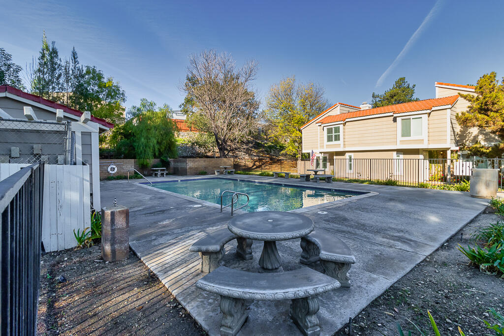 31355 The Old Road, Unit E Castaic, CA 91384 - Photo 34 of 38 a view of a backyard with sitting area