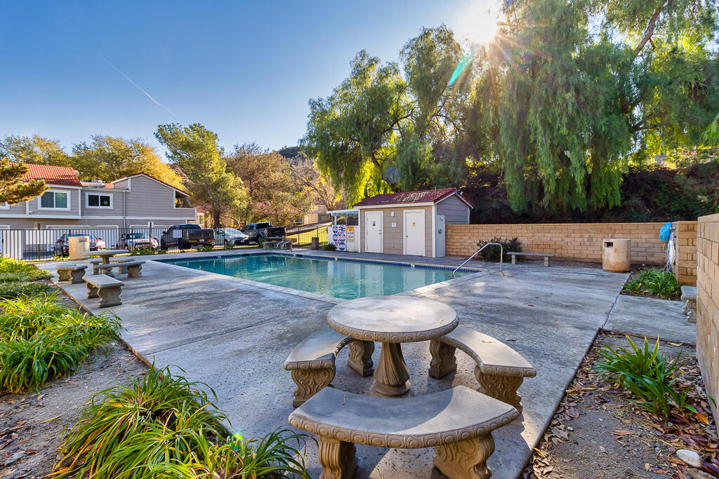 31355 The Old Road, Unit E Castaic, CA 91384 - Photo 35 of 38 a view of a backyard with sitting area