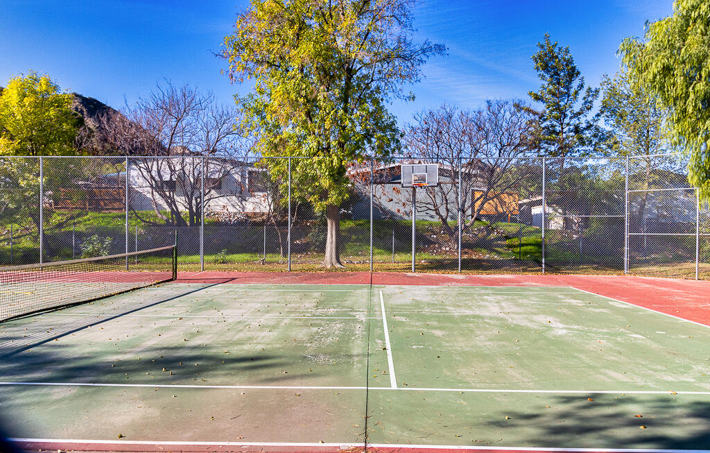 31355 The Old Road, Unit E Castaic, CA 91384 - Photo 36 of 38 a view of a playground with basketball court