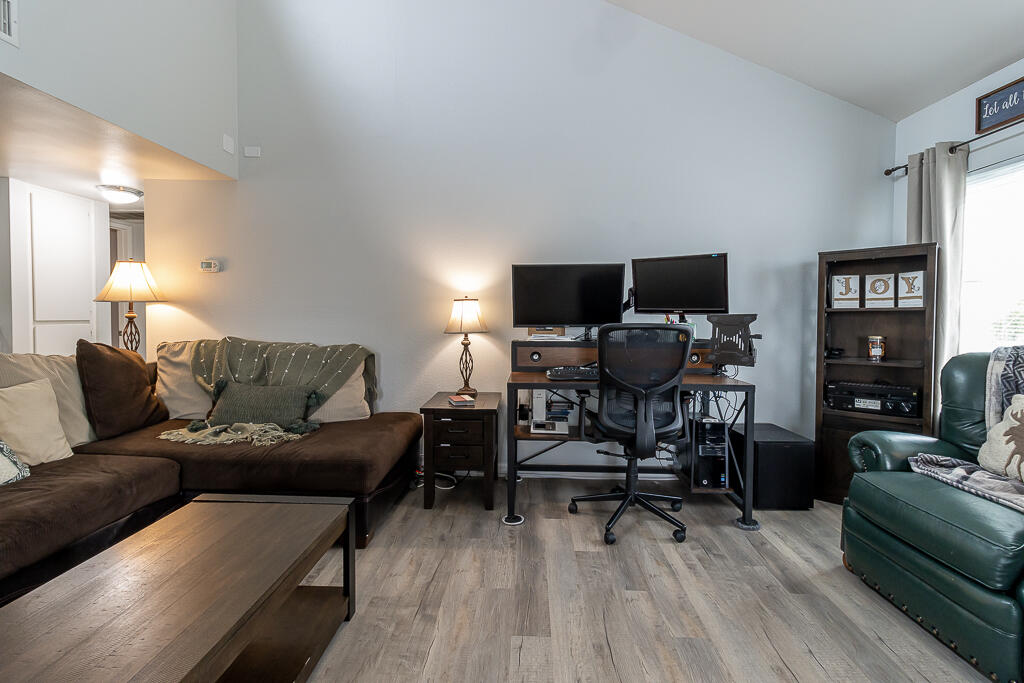 31355 The Old Road, Unit E Castaic, CA 91384 - Photo 10 of 38 a living room with furniture and a wooden floor