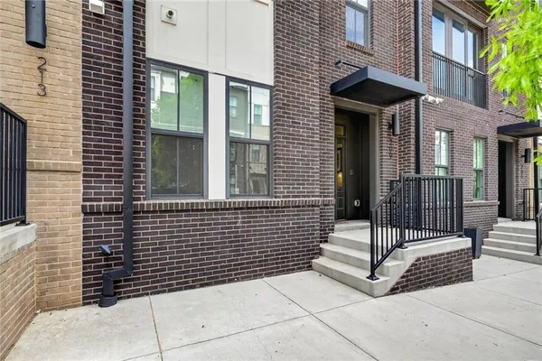 a view of a brick house with a door