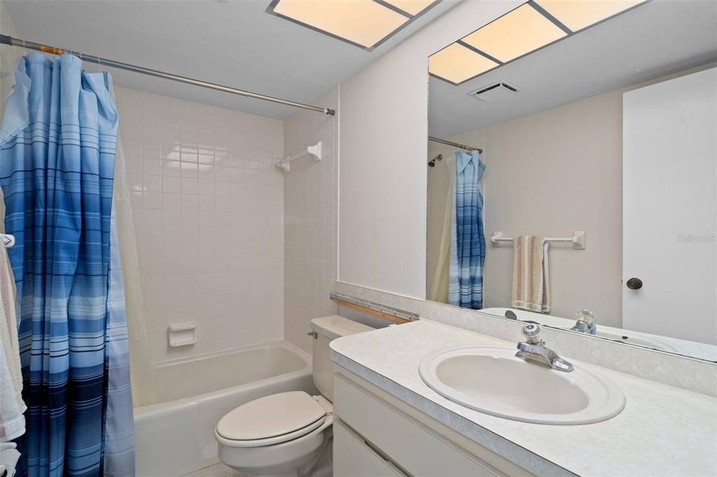 8211 Brent Street, Unit 836 Port Richey, FL 34668 - Photo 25 of 55 a bathroom with a sink toilet and shower