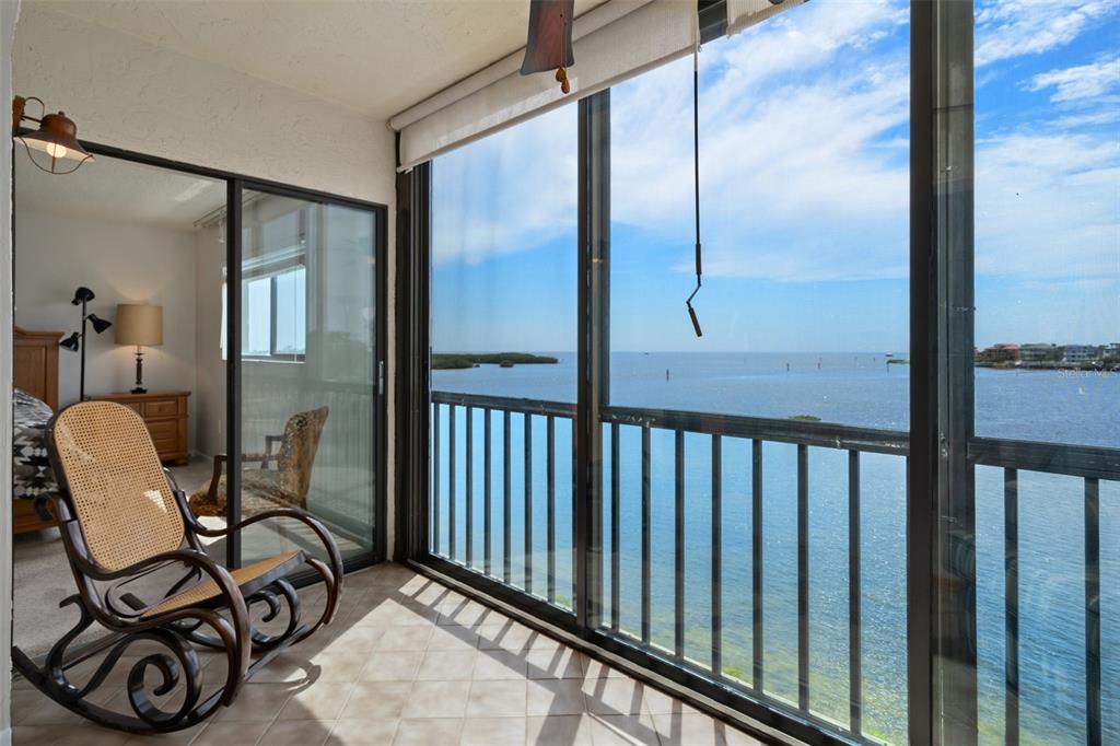8211 Brent Street, Unit 836 Port Richey, FL 34668 - Photo 28 of 55 a view of a door and chair in the balcony