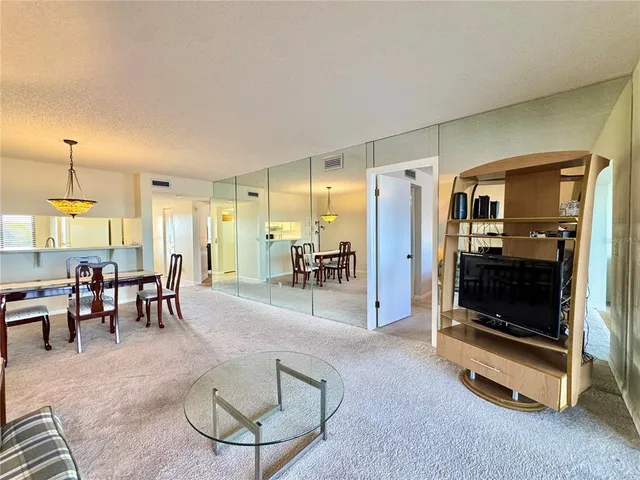 a kitchen with stainless steel appliances granite countertop a sink and cabinets with granite countertops