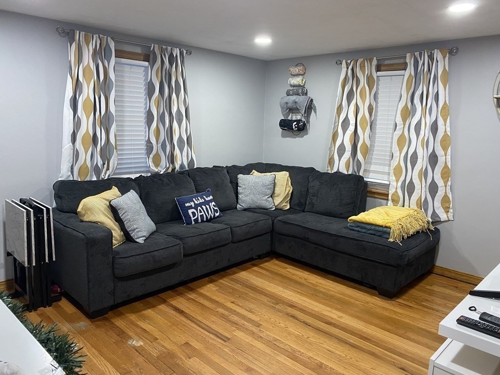 245 Edendale Street Springfield, MA 01104 - Photo 5 of 8 a living room with furniture and a large window