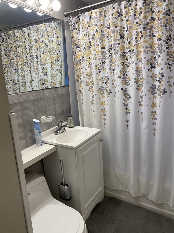 245 Edendale Street Springfield, MA 01104 - Photo 8 of 8 a bathroom with a sink toilet and shower