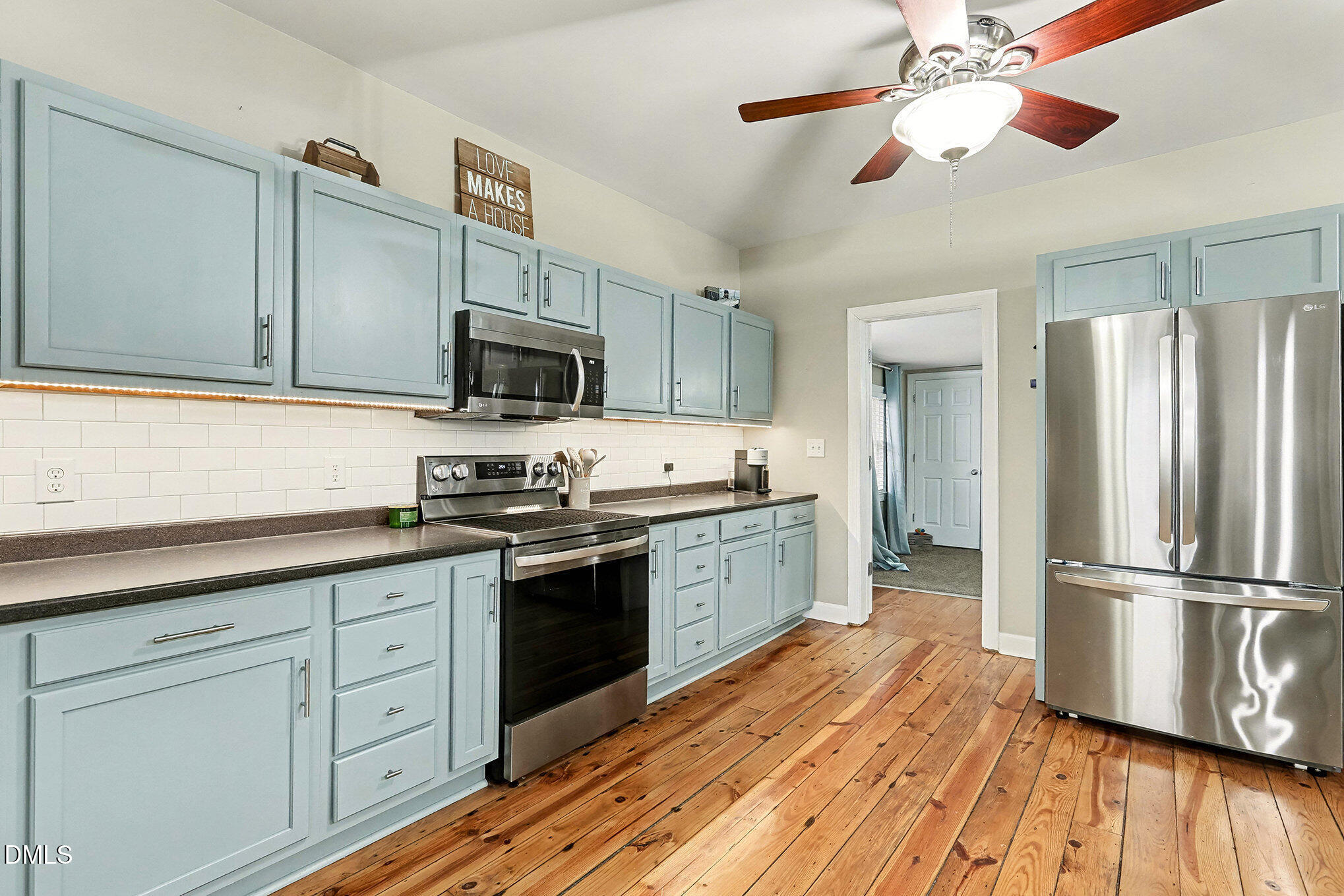 7228 Cleveland School Road Garner, NC 27529 - Photo 15 of 28 a kitchen with stainless steel appliances granite countertop a refrigerator a stove top oven a sink and dishwasher